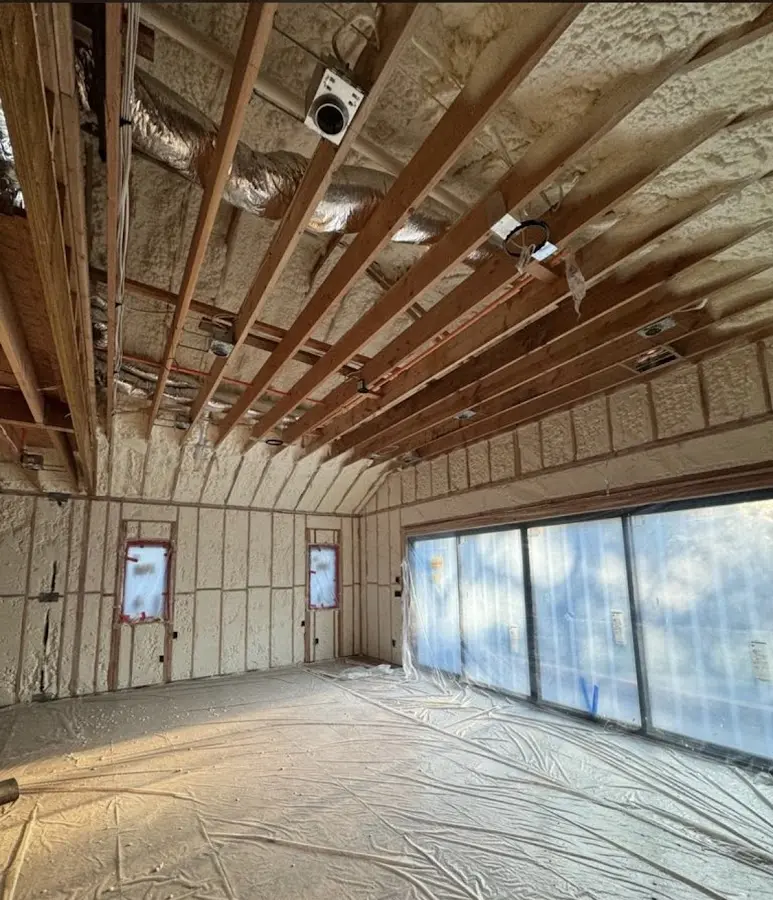 Interior walls and ceiling insulated with spray foam during new construction in Mililani Mauka